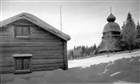 VINTERBILD KLOCKSTAPEL FRILUFTSMUSEUM